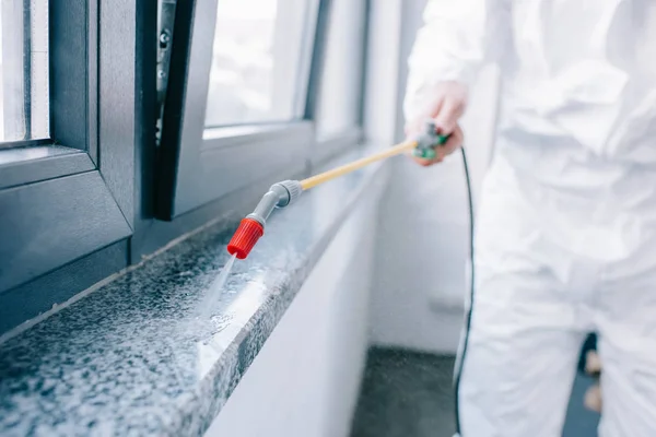 depositphotos_203574502-stock-photo-cropped-image-pest-control-worker